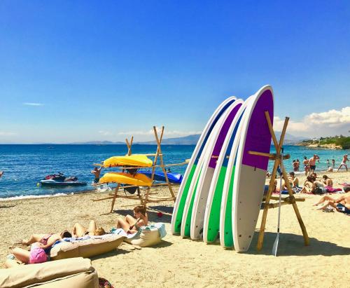 a group of surfboards sitting on a beach at Villa Naya by the Beach in Anavissos