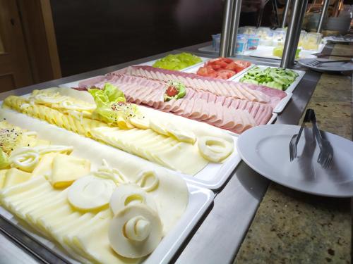 a buffet line with many different types of food at Dixon Resort in Banská Bystrica