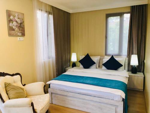En eller flere senge i et værelse på Holiday House Green Cape Batumi