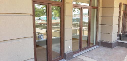 a group of glass windows on a building at Park Beach Apartments in Ohrid