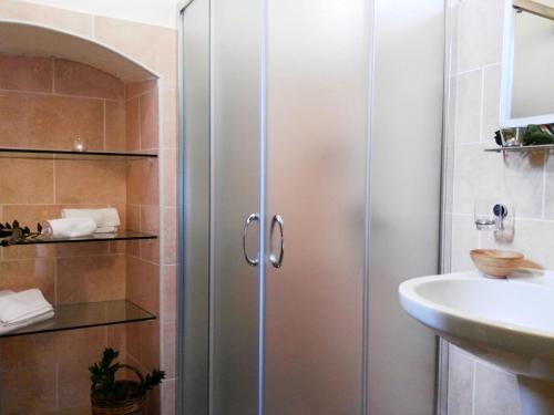 a bathroom with a shower and a sink at Agriturismo Francesca Stajano in Alezio