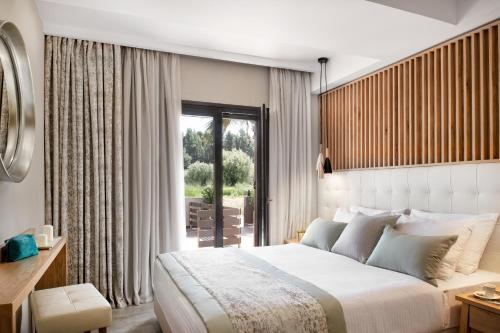 Una cama o camas en una habitación de Hotel Simeon