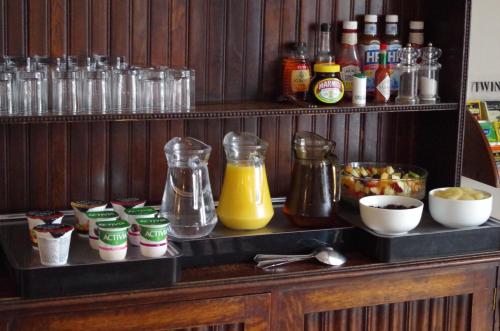 a counter with a bunch of food and drinks at Varley House in Ilfracombe