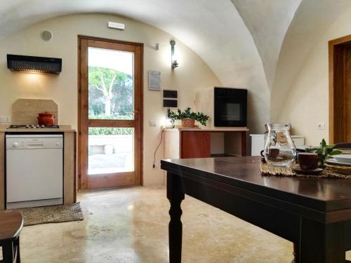 a kitchen with a large table in a room at Agriturismo Francesca Stajano in Alezio