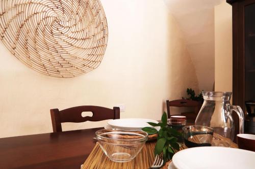 a dining room table with a wooden tableablish at Agriturismo Francesca Stajano in Alezio
