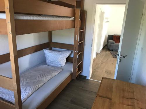 a bunk bed in a room with a staircase at Ferienwohnung Scholter in Eichstegen