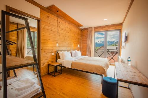 Postel nebo postele na pokoji v ubytování Chalet Mestia