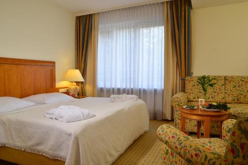 Giường trong phòng chung tại Hotel Domicil Berlin by Golden Tulip