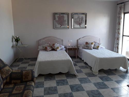 Ένα ή περισσότερα κρεβάτια σε δωμάτιο στο pension hernandez