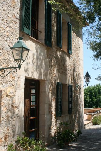 an old building with a door and a street light at Agroturismo Son Siurana in Alcudia