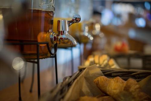 a close up of a drink dispenser with some food at Lifeboat Inn in St Ives