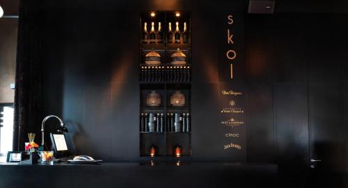 a bottle of wine on the wall of a bar at Skol l'Original in Luxembourg