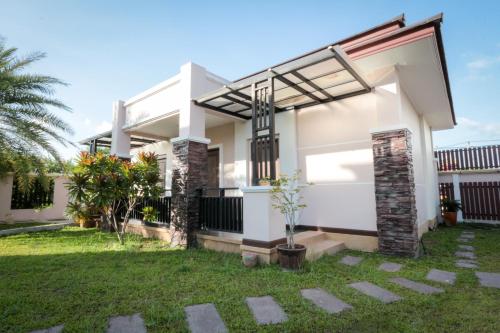 a rendering of a house with a garden at Fortune Surin Hotel in Surin