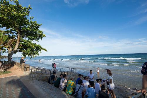 a group of people standing at the beach at Grandbeach2 B52 By malai in Mae Pim