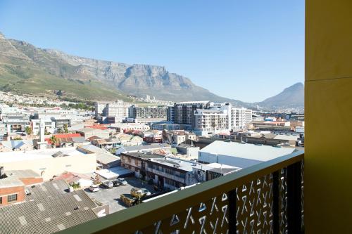 a view of a city with mountains in the background at Wex 1 Apartments in Cape Town
