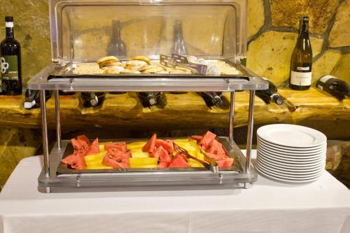 a plate of food on top of a table at Hotel Polar Star in Žabljak