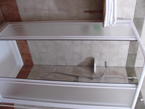 a view through a glass window of a bath tub at Agriturismo Ai Laghi in Pocenia