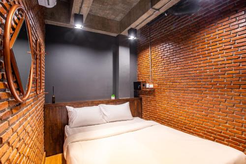 Postel nebo postele na pokoji v ubytování Kaen Hostel
