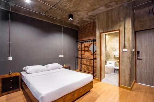 Postel nebo postele na pokoji v ubytování Kaen Hostel