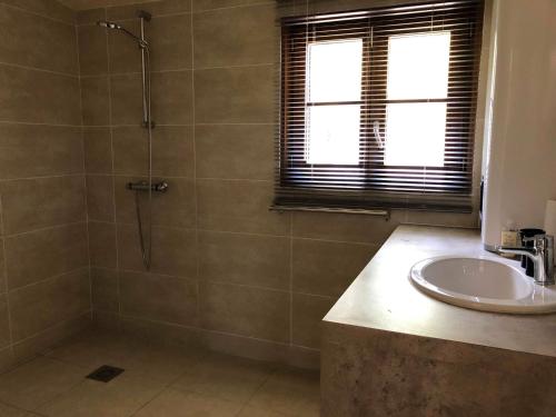 a bathroom with a shower and a sink at Weekend en Provence in Comps