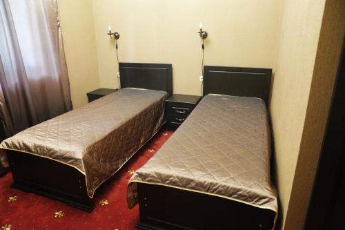 Postel nebo postele na pokoji v ubytování DzhaNat Hotel