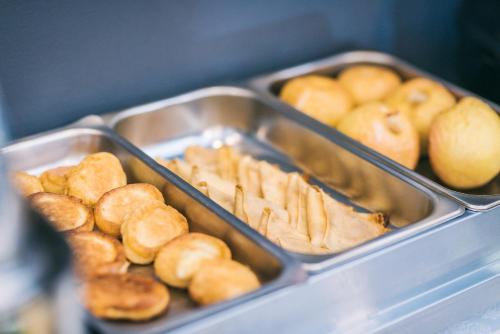 a tray of pastries and breads in at Hotel Forum in Rzeszów