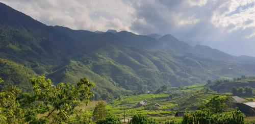 a view of a valley with mountains in the background at La Beauté Sa Pa in Sa Pa