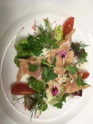 a plate of food with meat and vegetables on it at Der Erlhof Restaurant & Landhotel in Zell am See