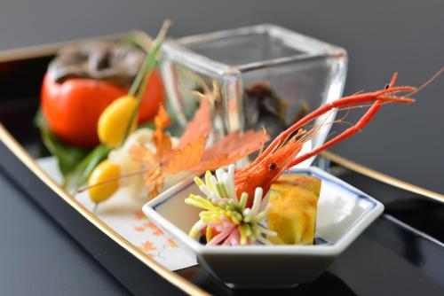 a tray with a plate of food on a table at Biwako Hanakaido in Otsu