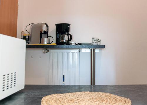 a counter in a kitchen with a counter top at Apartment am Bahnhof in Salzburg