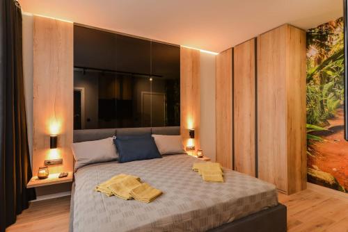 a bedroom with a bed with two towels on it at Urban Eden - LUX & STYLE, 2-Bedroom, 2-Bathroom in Sofia