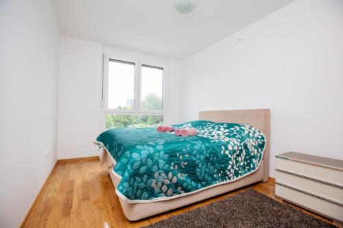 Ένα ή περισσότερα κρεβάτια σε δωμάτιο στο Ljubljana finest apartment