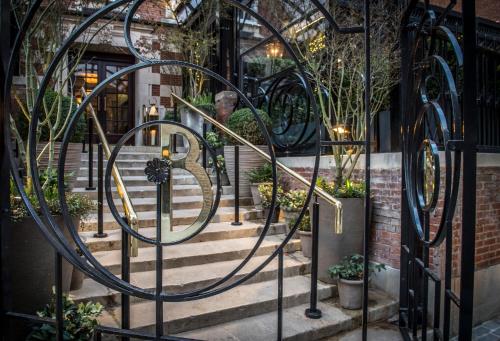 a metal gate with stairs in front of a building at The Bloomsbury Hotel in London