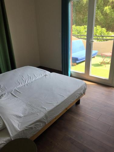 Postel nebo postele na pokoji v ubytování MON FARE