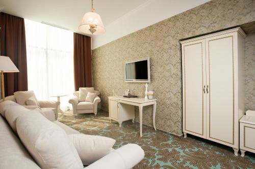 Μια τηλεόραση ή/και κέντρο ψυχαγωγίας στο Hotel Misto SPA & FITNESS