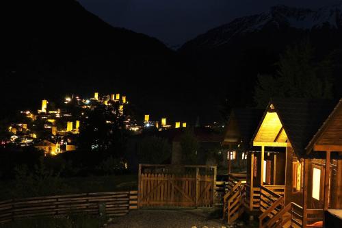 a view of a city at night with a town at Mountain Cabins in Mestia