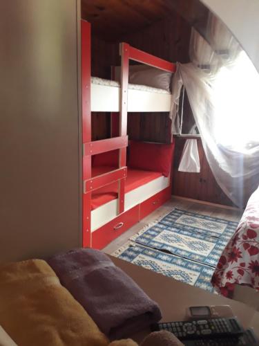 a room with a bunk bed and a desk with a keyboard at Side Tuana Garden Home in Side
