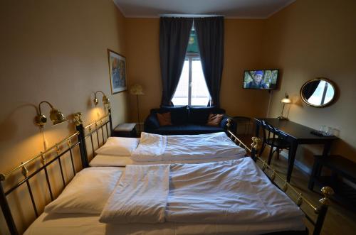 Ένα ή περισσότερα κρεβάτια σε δωμάτιο στο Hotell Royal