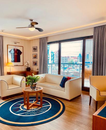 a living room with a couch and a table at Hotel Gdańsk Boutique in Gdańsk