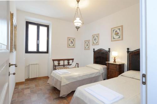Ένα ή περισσότερα κρεβάτια σε δωμάτιο στο Casa Vacanze Podere Ugolini