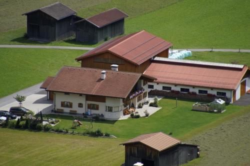 an aerial view of a house with roofs at Haus Gaby in Holzgau