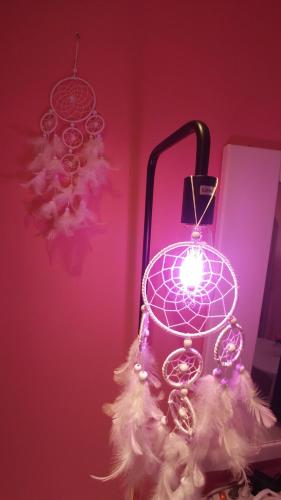 a purple light with a christmas ornament on a table at Spring Light in Seoul