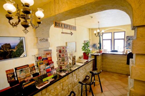 a shop with a counter and stools in a room at Gästehaus Mezcalero in Dresden