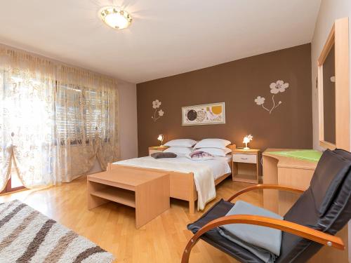 Postel nebo postele na pokoji v ubytování Apartments Nada