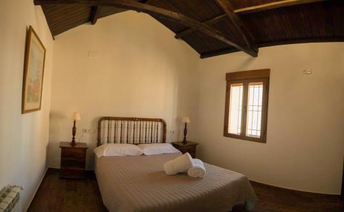 Кровать или кровати в номере Casa Rural Gafas