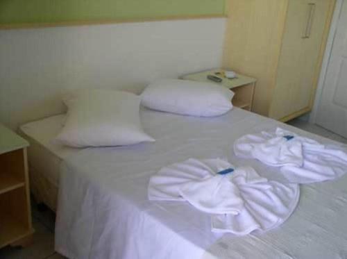 Postel nebo postele na pokoji v ubytování Hotel Pousada Mineirinho