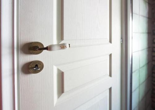 a white door with a door knob on it at Athenian Residences in Athens