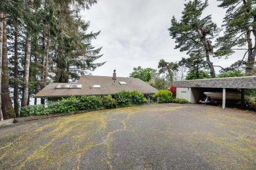 a house with a driveway and a garage at Delake House in Otis