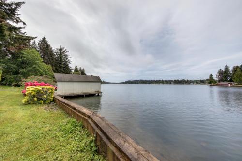 a building sitting on the side of a lake at Delake House in Otis