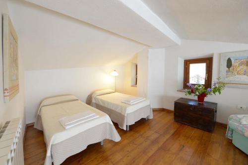 Ένα ή περισσότερα κρεβάτια σε δωμάτιο στο Casa Vacanze Podere Ugolini